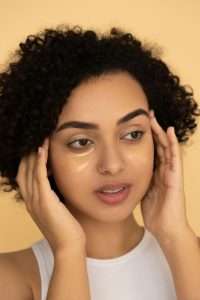 Woman caring for dry patchy skin as part of a gentle skincare routine