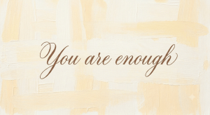 You are enough -- “You are enough” affirmation written in script on a soft cream and neutral background.